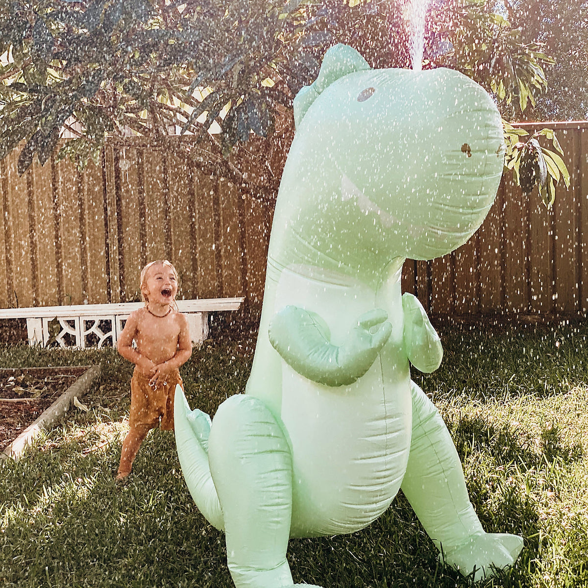 SUNNYLIFE Inflatable Giant Sprinkler Surfing Dino